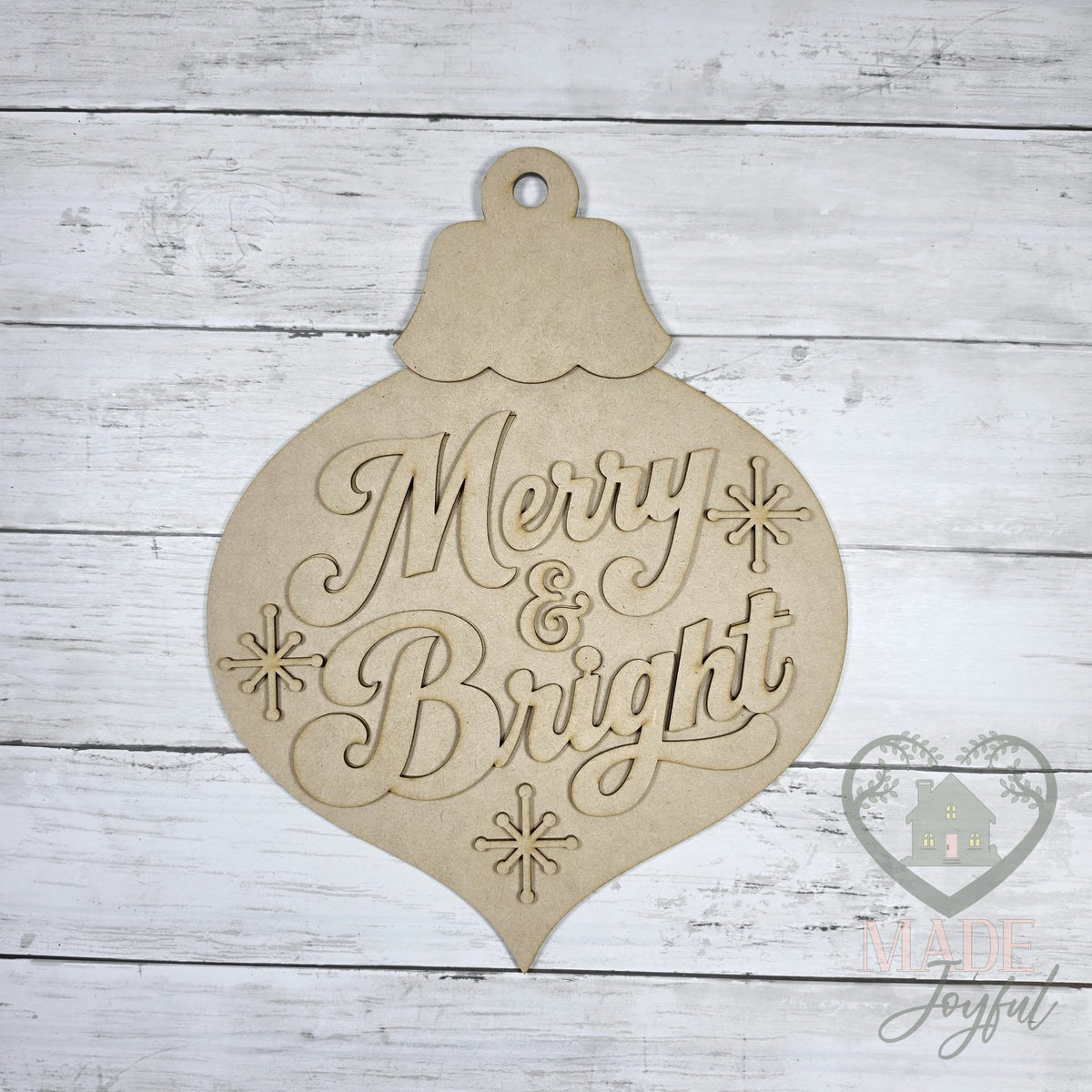 Unfinished laser-cut wood Merry & Bright Vintage Bulb Door Hanger DIY kit, ready to paint at a DIY party in Williamson County, TN.
