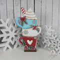 Stacked hot cocoa mugs shelf sitter in aqua, white, and red with whipped cream and peppermints, hand-painted in Brentwood, TN.