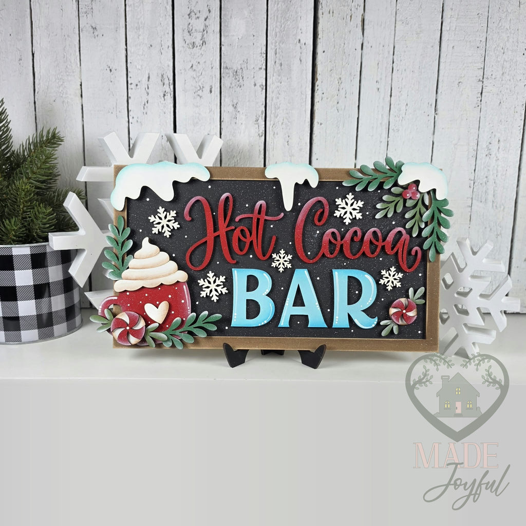 Framed Hot Cocoa BAR sign with snowy icing, holly, snowflakes, and a peppermint cocoa mug, hand-painted in Brentwood, TN.