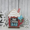 Red Hot Cocoa Bar mug shelf sitter with whipped cream, candy cane straw, chalkboard label, and blue bow, hand-painted in Brentwood, TN.