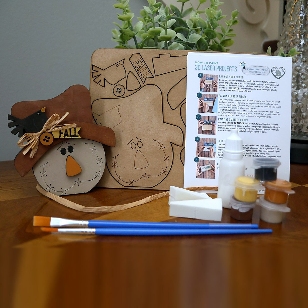 Kids DIY paint kit: FALL scarecrow with crow and raffia bow, with wood pieces, paints, brushes, sponges, glue and instructions. A favorite at kids' DIY parties in Williamson County, TN