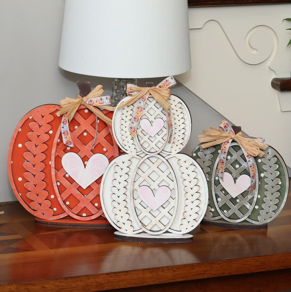 Sweater Weather pumpkin shelf sitters hand-painted in warm fall colors with bows, painted in Brentwood, TN.