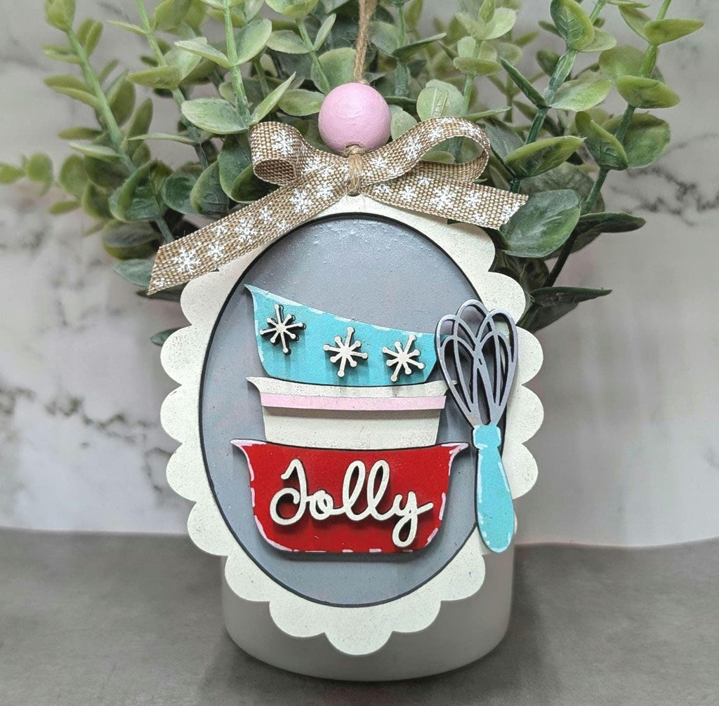 Hand-painted retro Christmas baking ornaments with a stand mixer, mixing bowls, utensils, gingerbread and Cookie Crew designs, hand-painted in Brentwood, TN.